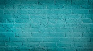 background of painted bricks in a deep teal color